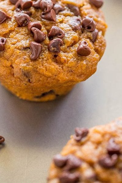 Mini Pumpkin Chocolate Chip Muffins — Easy, no mixer recipe for the SOFTEST, moistest, most ADORABLE little muffins ever!! Rich PUMPKIN flavor and CHOCOLATE in every bite!!